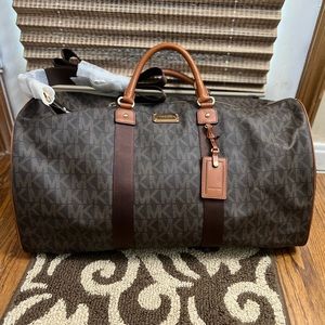 Brown New Michael Kors travel duffel bag.
